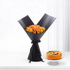 Vibrant orange roses in sleek black wrap beside jack-o&