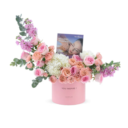 Pink box with roses, hydrangeas, eucalyptus, "You Inspire!" text, and spa gift card.