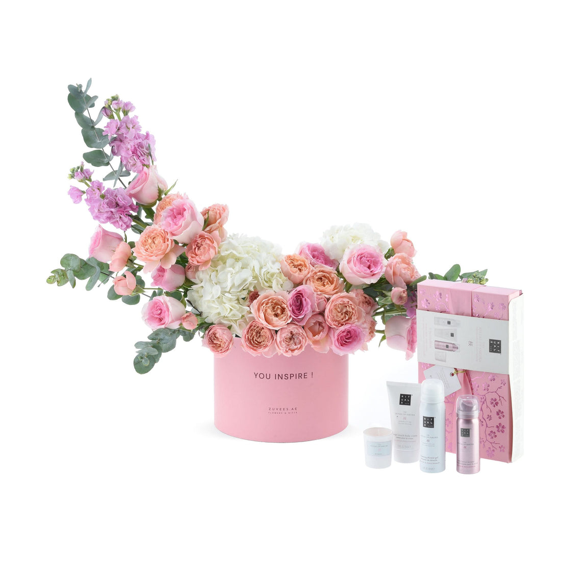 Pink floral arrangement with "YOU INSPIRE!" text, paired with Rituals Sakura gift set.