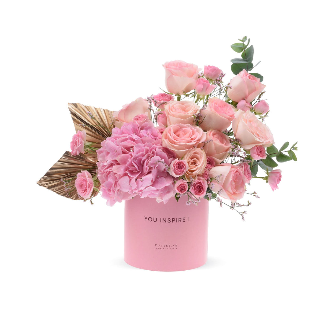 Pink roses and hydrangeas in a branded pink box with gold leaf accent.