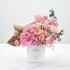 Soft pink roses and hydrangeas in white box with "I&