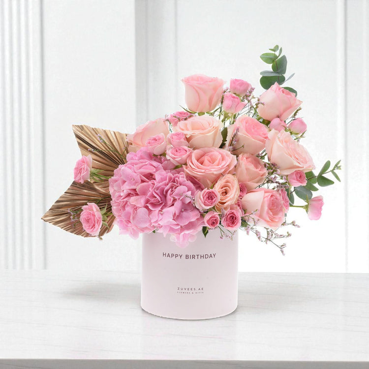Soft pink roses and hydrangeas in a "Happy Birthday" box with gold leaf accent.