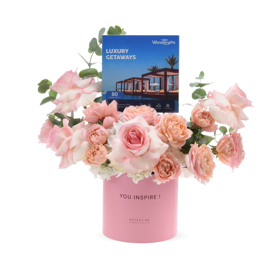 Pink roses in "YOU INSPIRE!" box with luxury getaway gift card.
