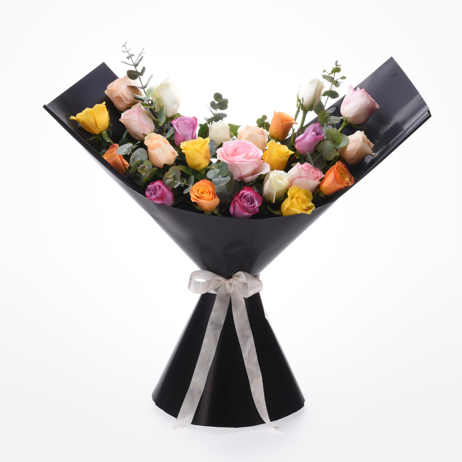 Vibrant multi-colored roses elegantly wrapped in glossy black paper with silver ribbon.