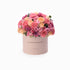 Pastel pink box overflowing with vibrant roses and carnations, "Congratulations" printed.