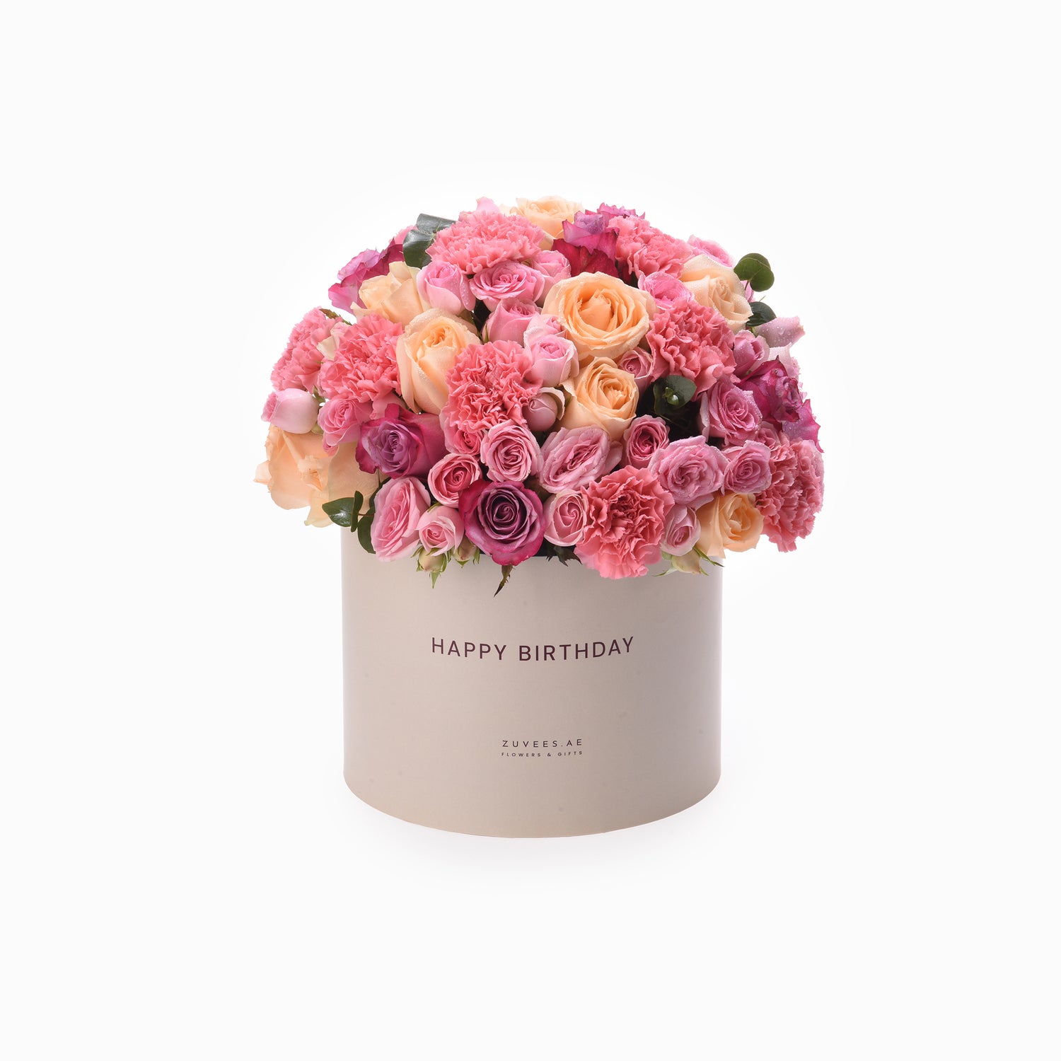 Pastel pink and peach roses and carnations in beige box with "Happy Birthday" text.