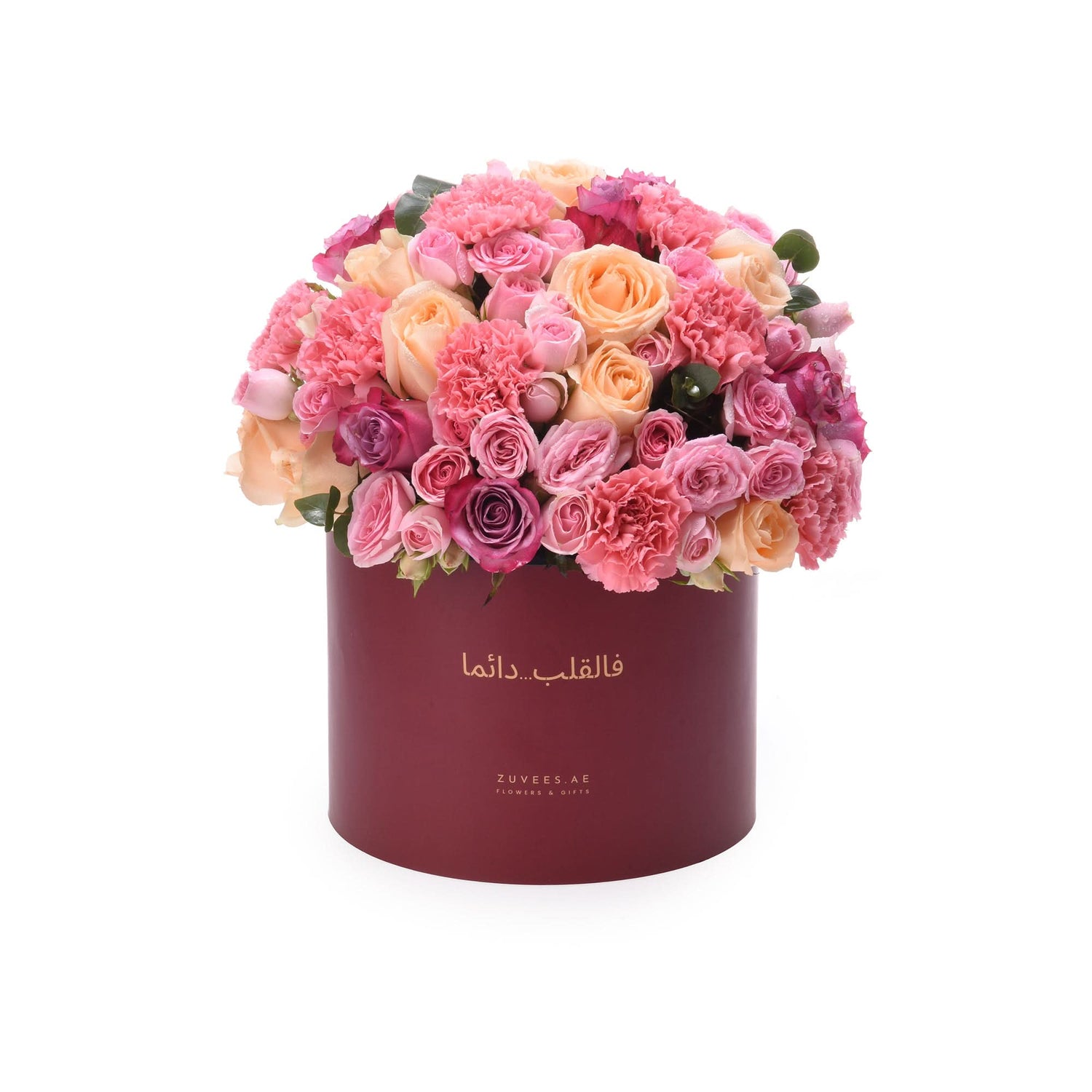 Luxury pink peach rose carnation bouquet in deep red Zuvees box, Arabic script elegance.