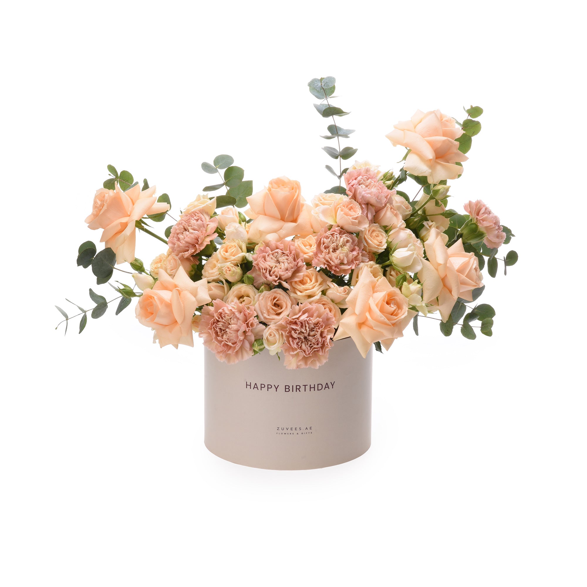Soft peach roses, carnations, eucalyptus in white "Happy Birthday" gift box.