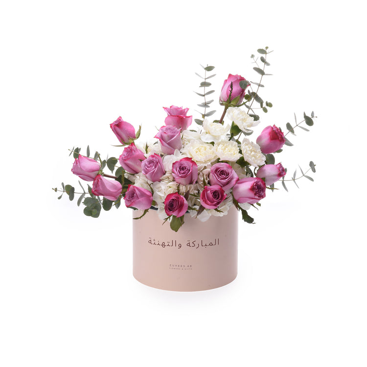 Pink and white roses with eucalyptus in blush box, Arabic greeting.