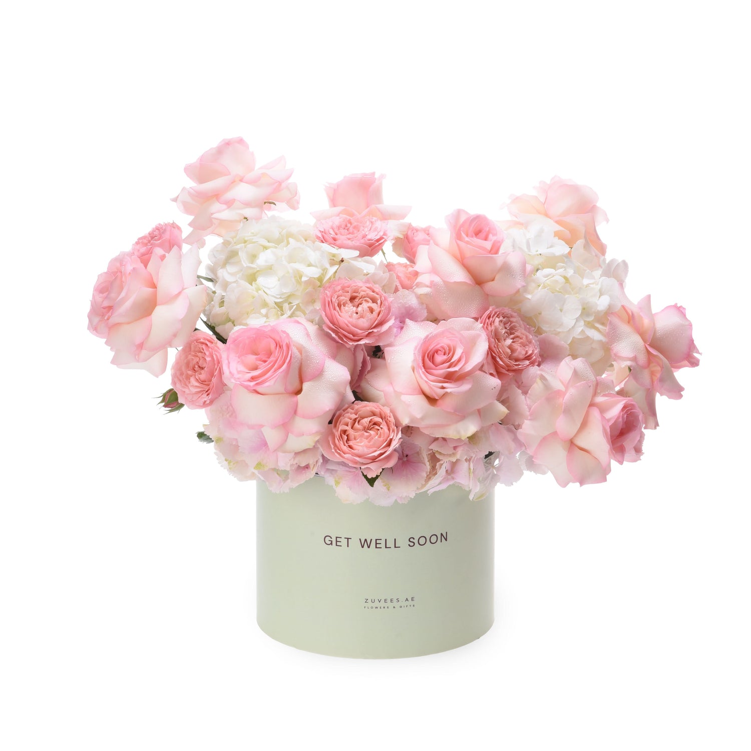 Pastel pink roses and hydrangeas in mint box reading "Get Well Soon".