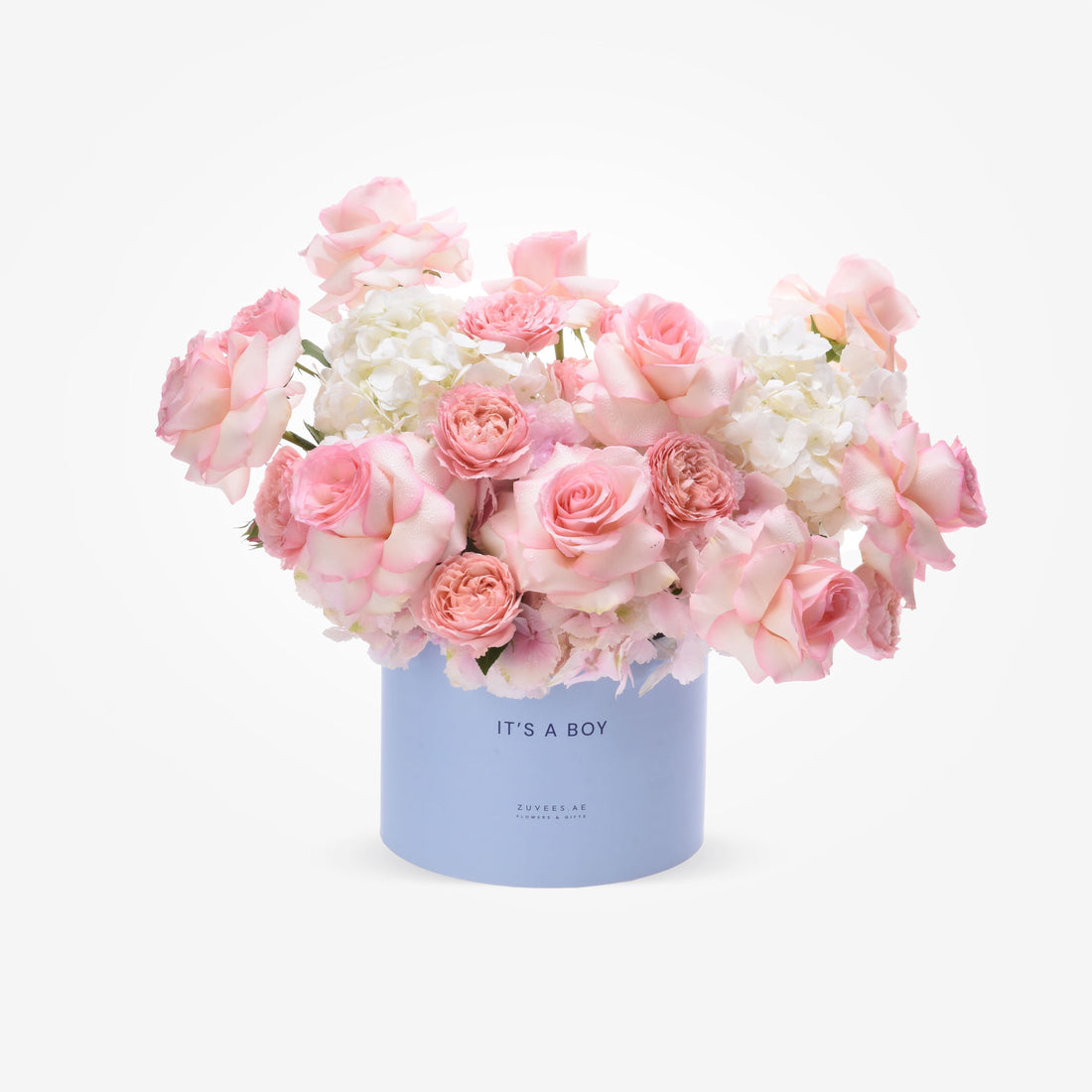 Pastel pink roses and hydrangeas in light blue “It’s a Boy” gift box.