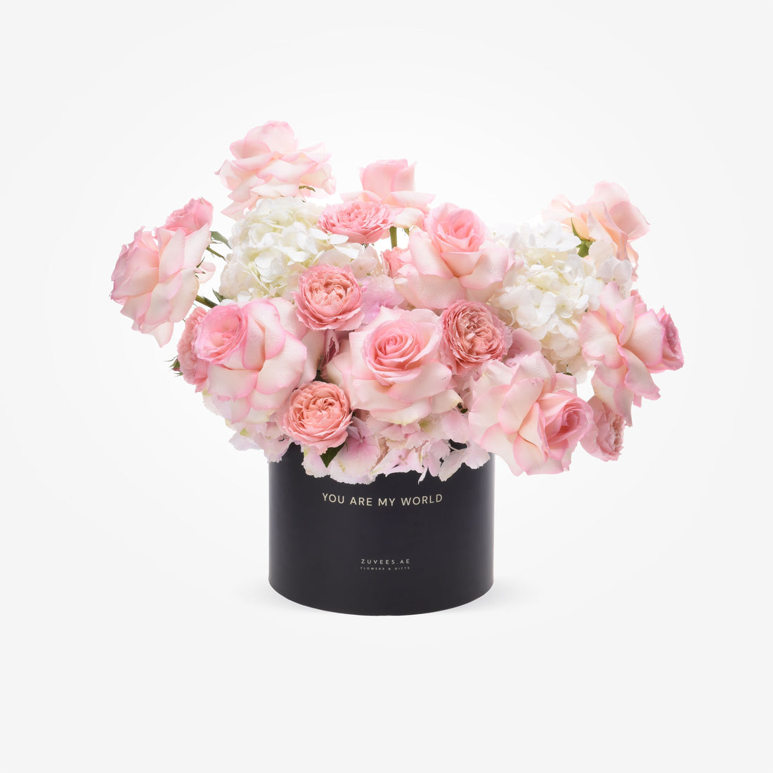 Pink roses and hydrangeas in black box reading "You Are My World".