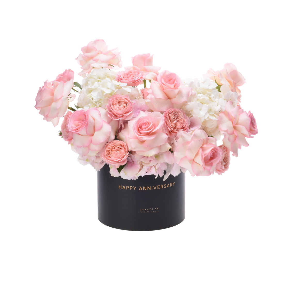 Elegant pink roses and hydrangeas in black box with gold "Happy Anniversary" text.