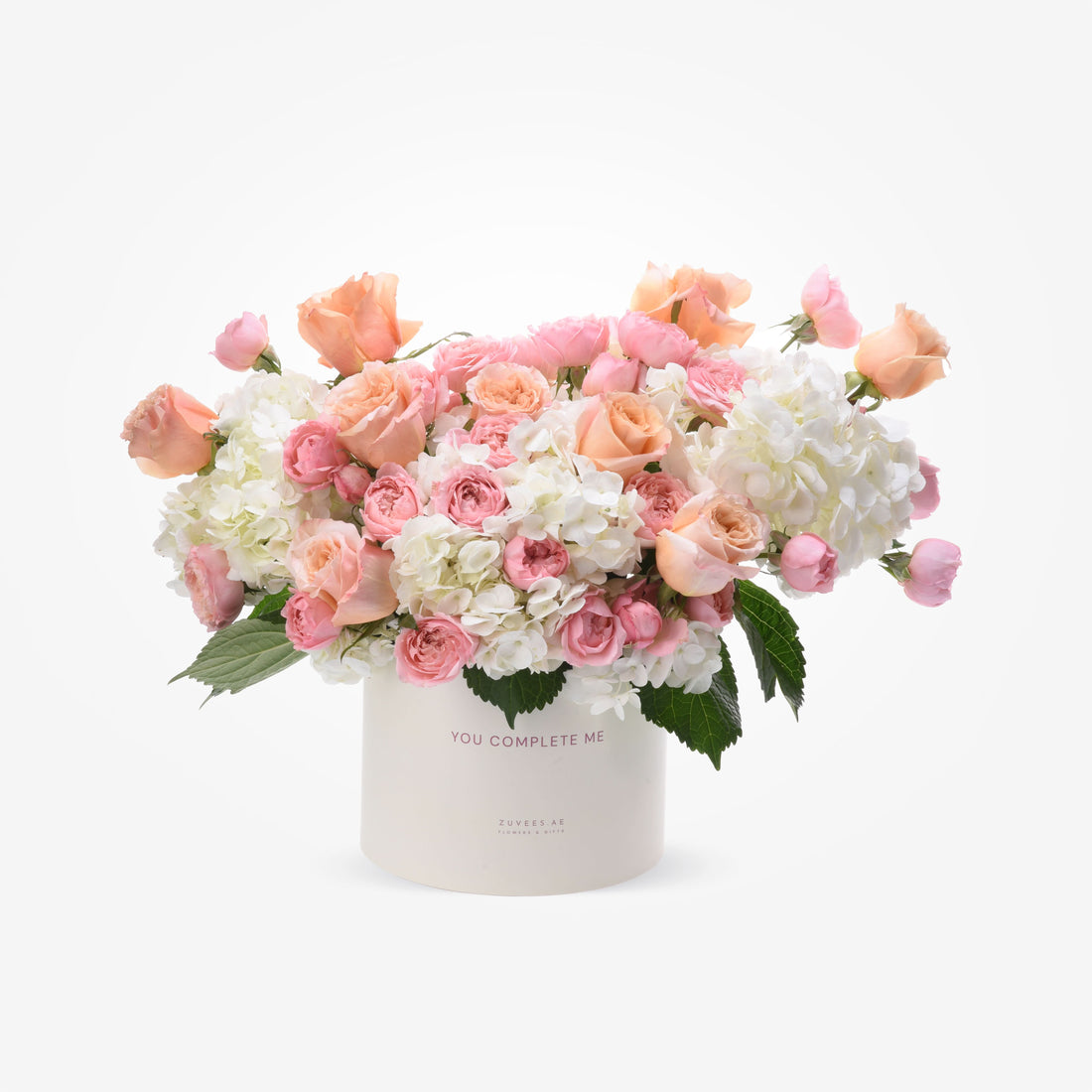 Soft pink roses and white hydrangeas in elegant ivory box with "You Complete Me" message.