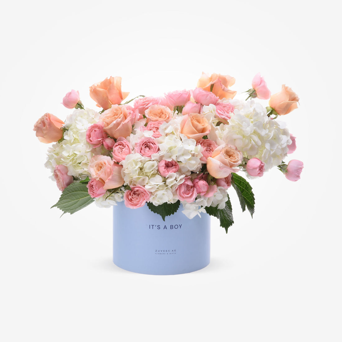 Soft peach roses and white hydrangeas in a light blue "It&