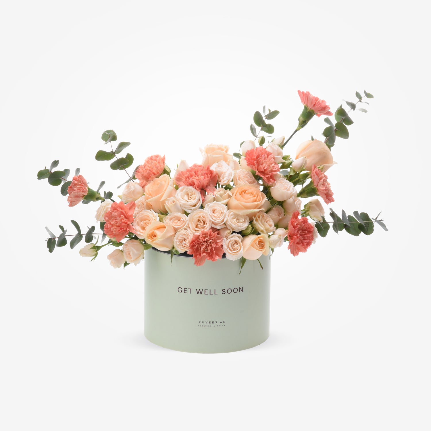 Pastel peach roses and carnations in mint-green "Get Well Soon" box.